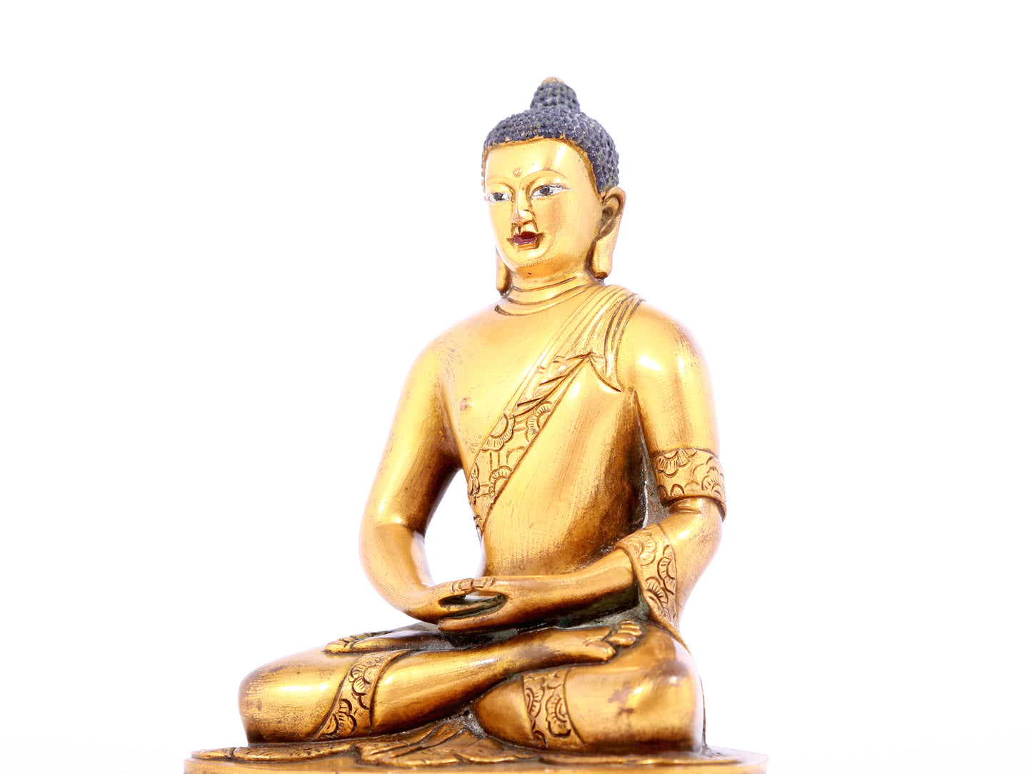 A solemn gilt bronze statue of Sakyamuni