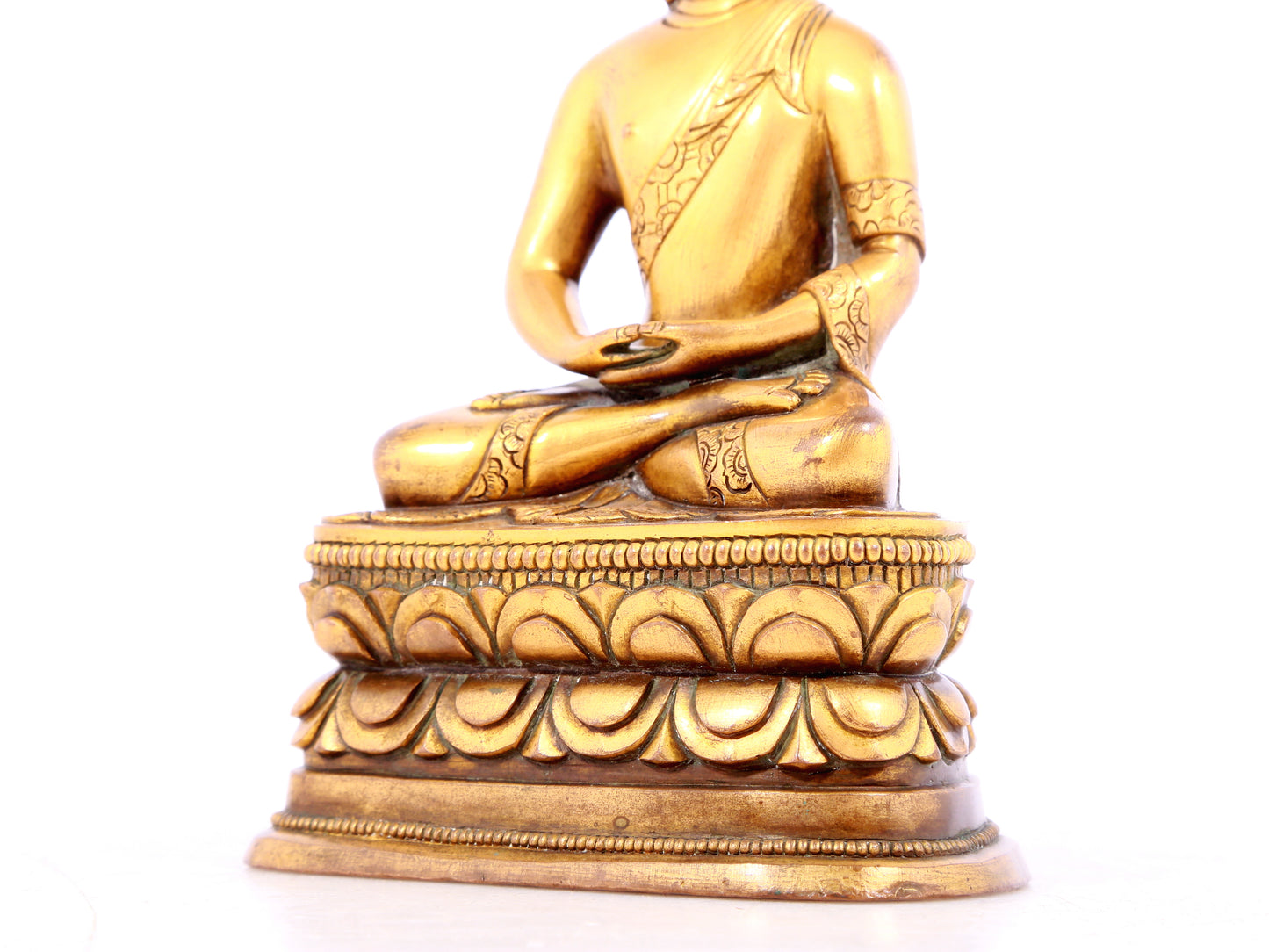 A solemn gilt bronze statue of Sakyamuni