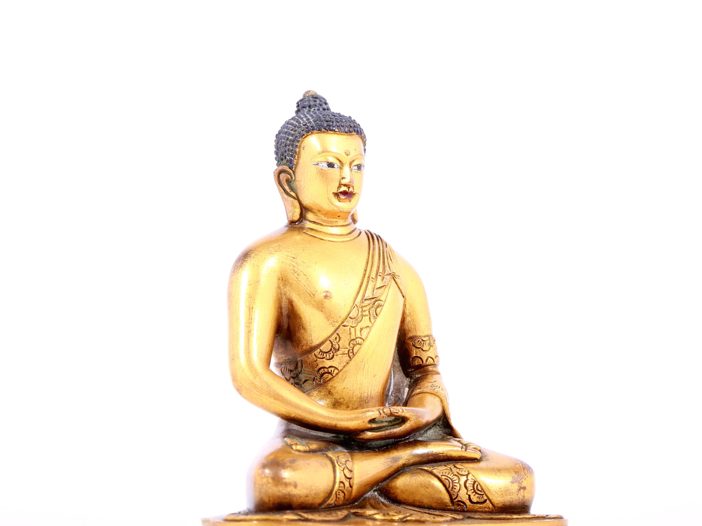 A solemn gilt bronze statue of Sakyamuni