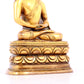 A solemn gilt bronze statue of Sakyamuni