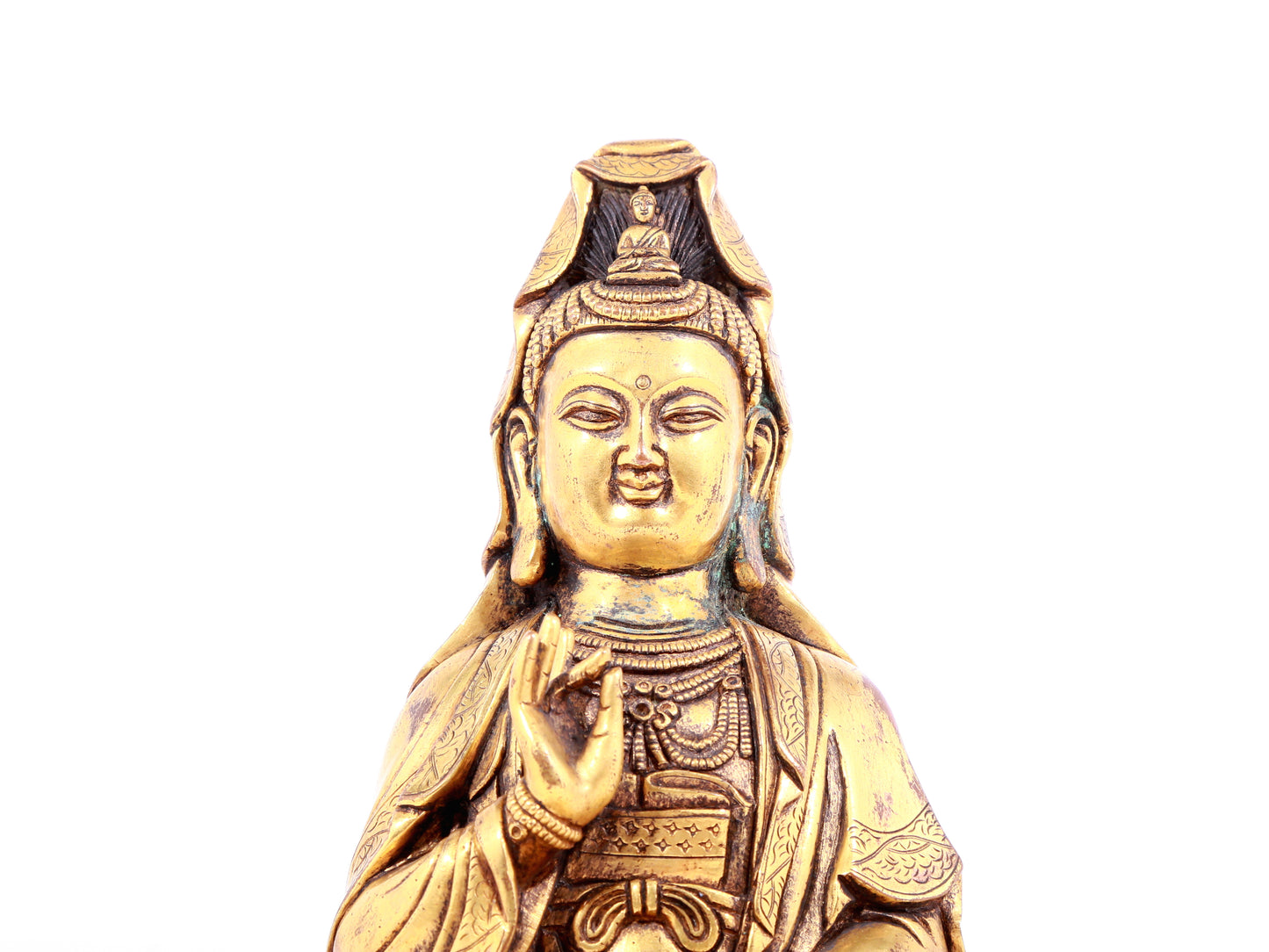 A solemn gilt bronze statue of Guanyin