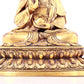 A solemn gilt bronze statue of Guanyin