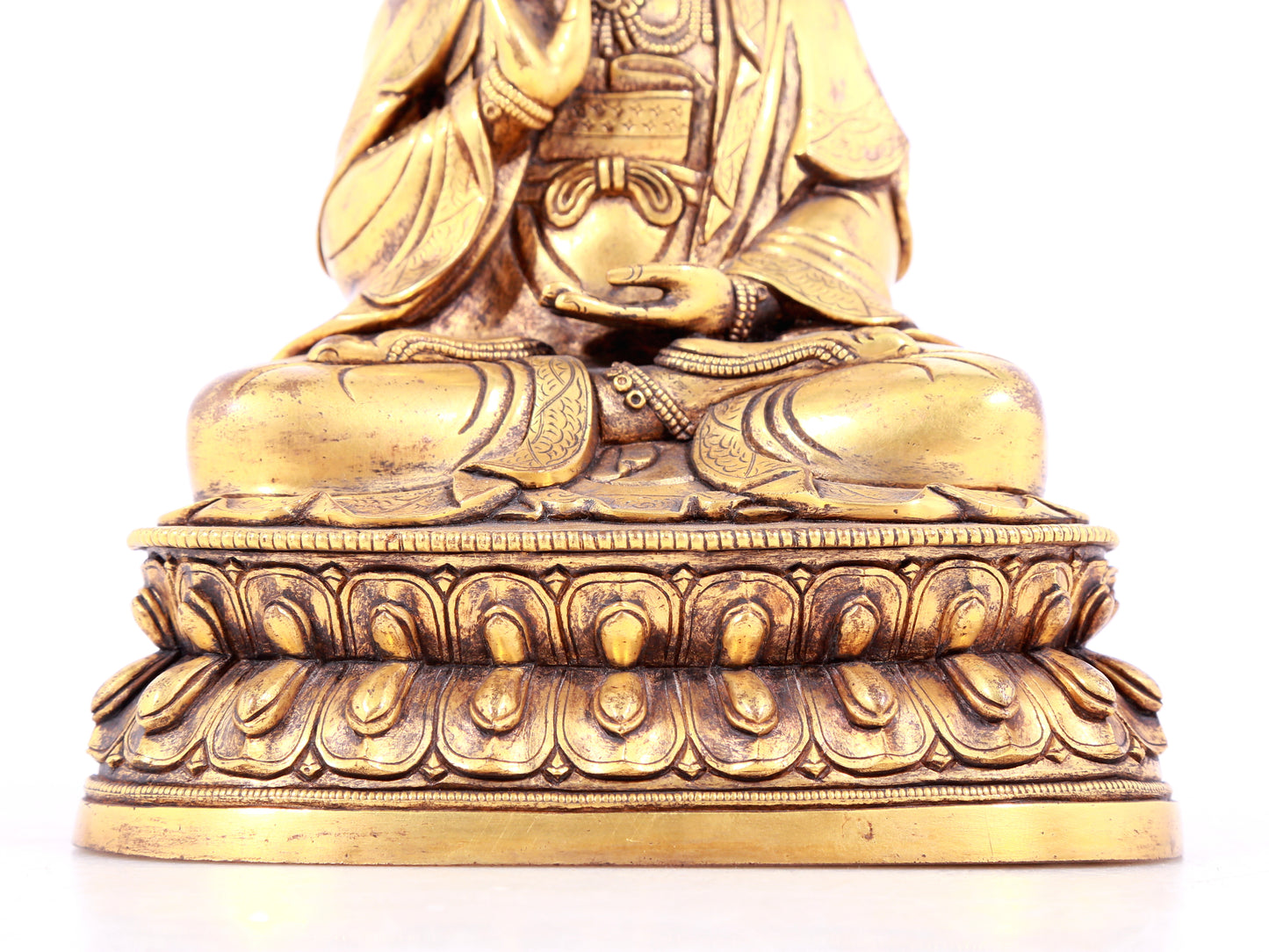 A solemn gilt bronze statue of Guanyin