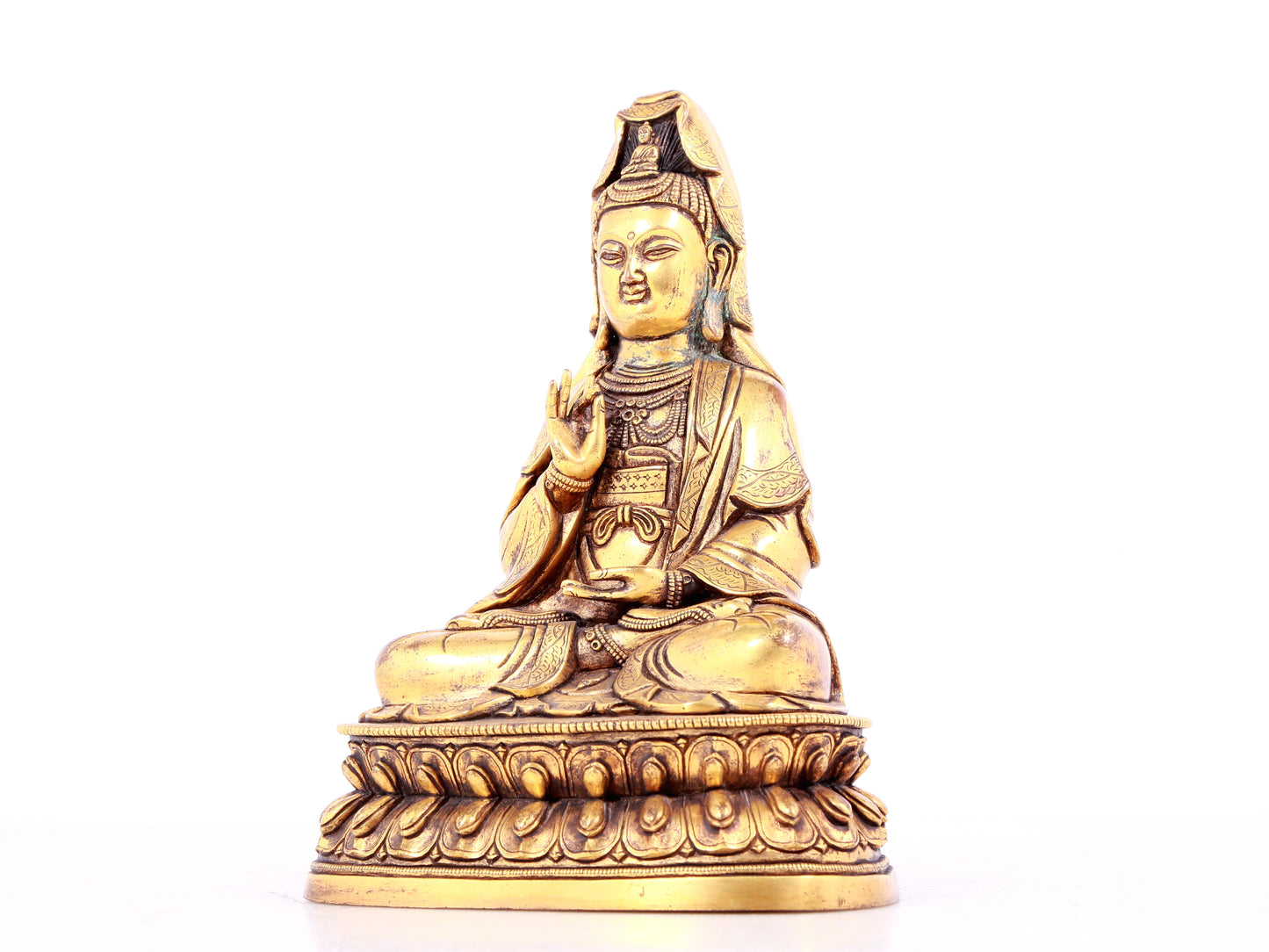 A solemn gilt bronze statue of Guanyin