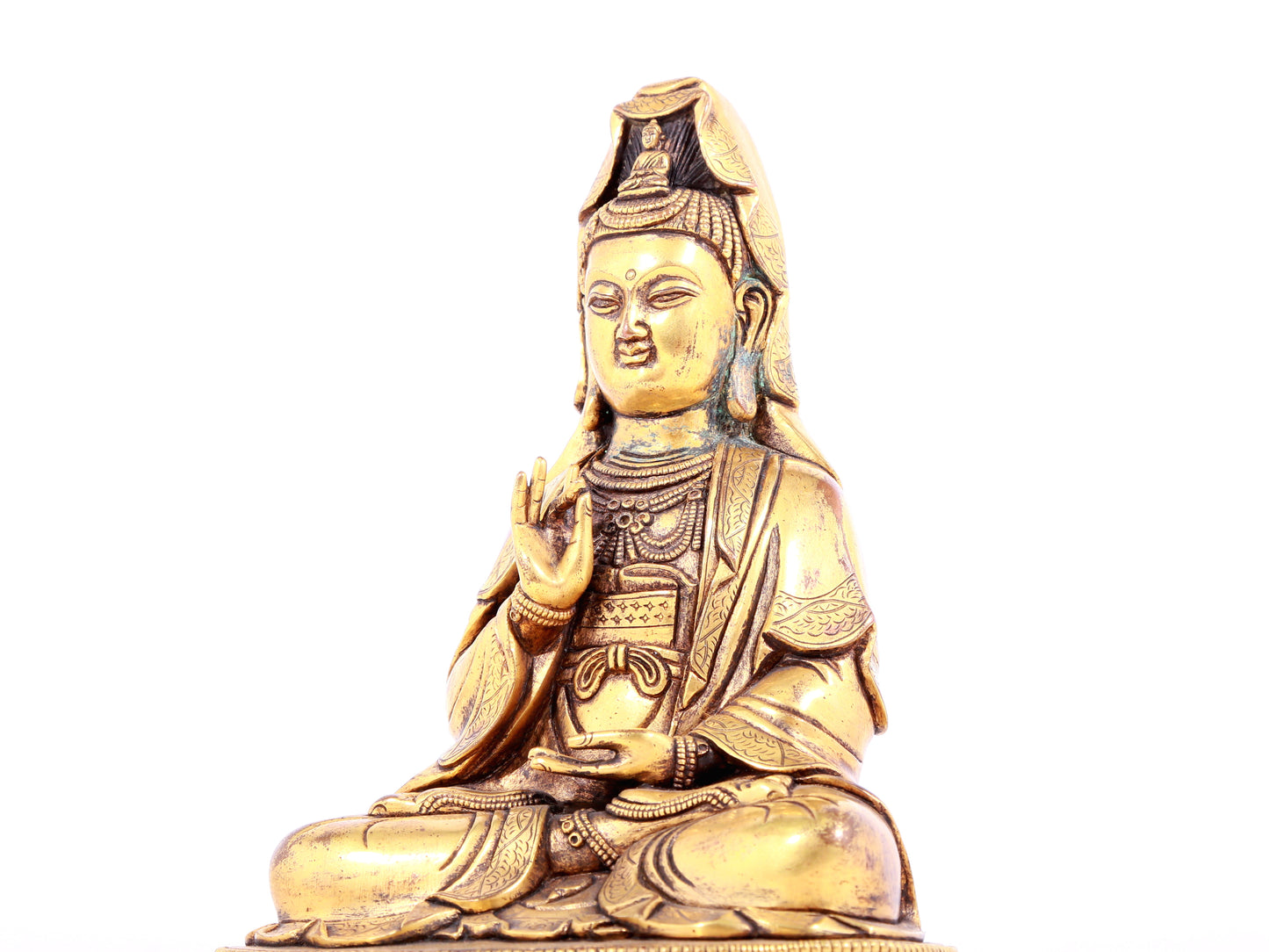 A solemn gilt bronze statue of Guanyin