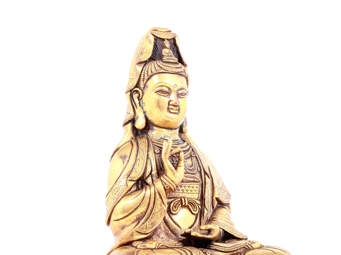 A solemn gilt bronze statue of Guanyin