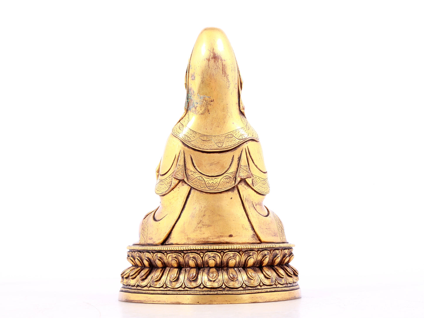 A solemn gilt bronze statue of Guanyin