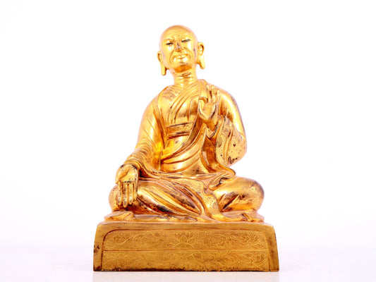 A solemn gilt bronze statue of guru