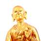 A solemn gilt bronze statue of guru