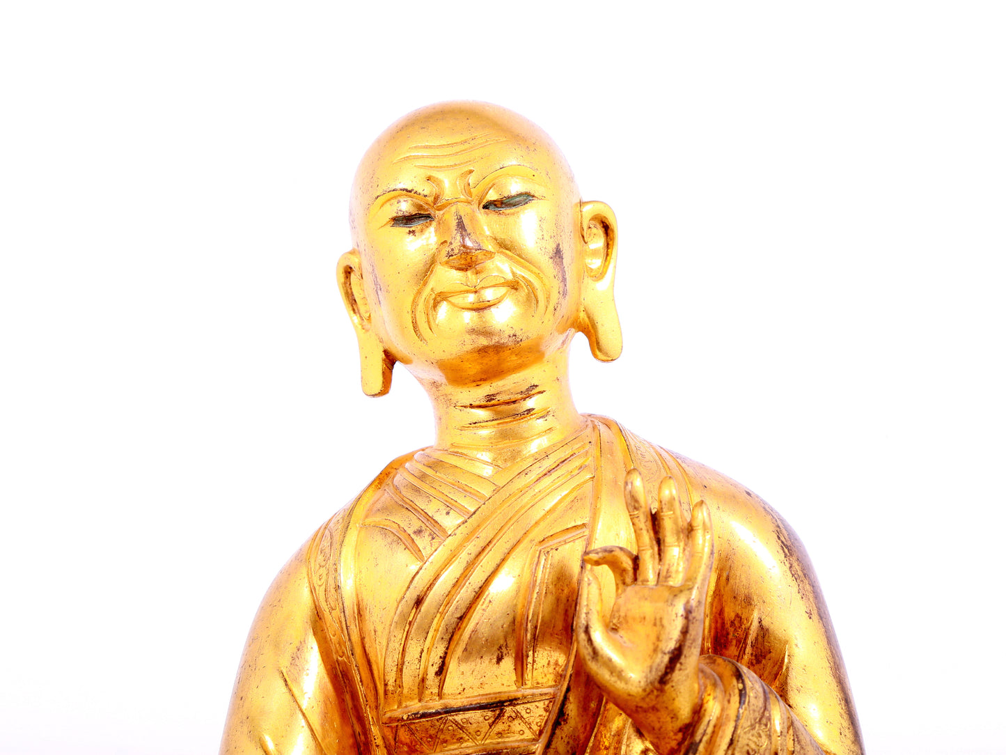 A solemn gilt bronze statue of guru