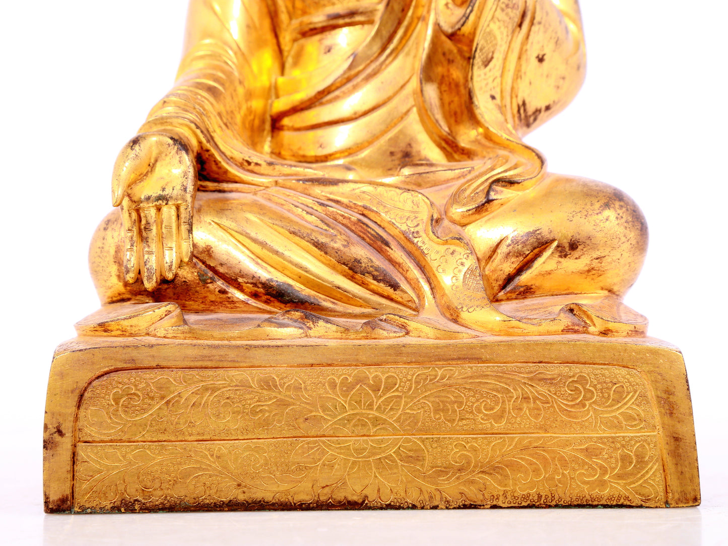 A solemn gilt bronze statue of guru