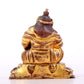 A solemn gilt bronze statue of guru