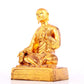 A solemn gilt bronze statue of guru