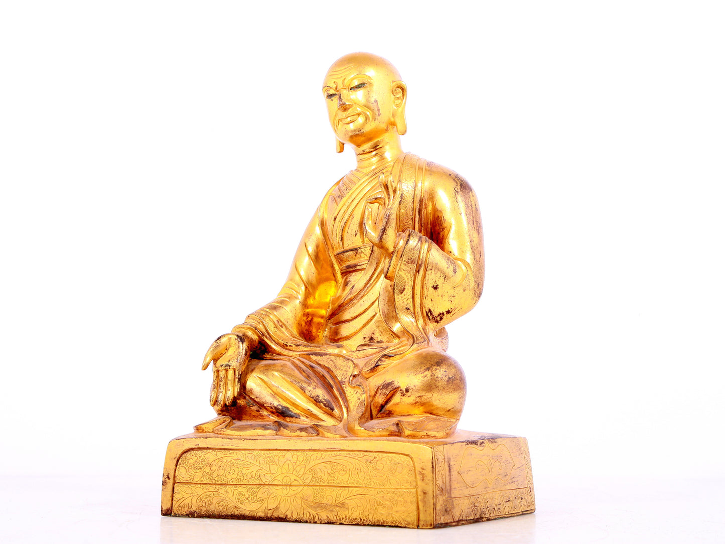 A solemn gilt bronze statue of guru