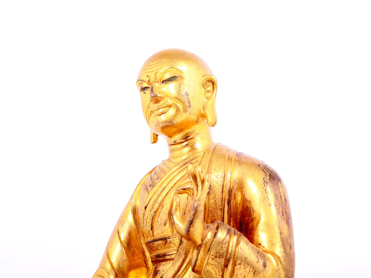 A solemn gilt bronze statue of guru