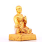 A solemn gilt bronze statue of guru