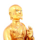 A solemn gilt bronze statue of guru