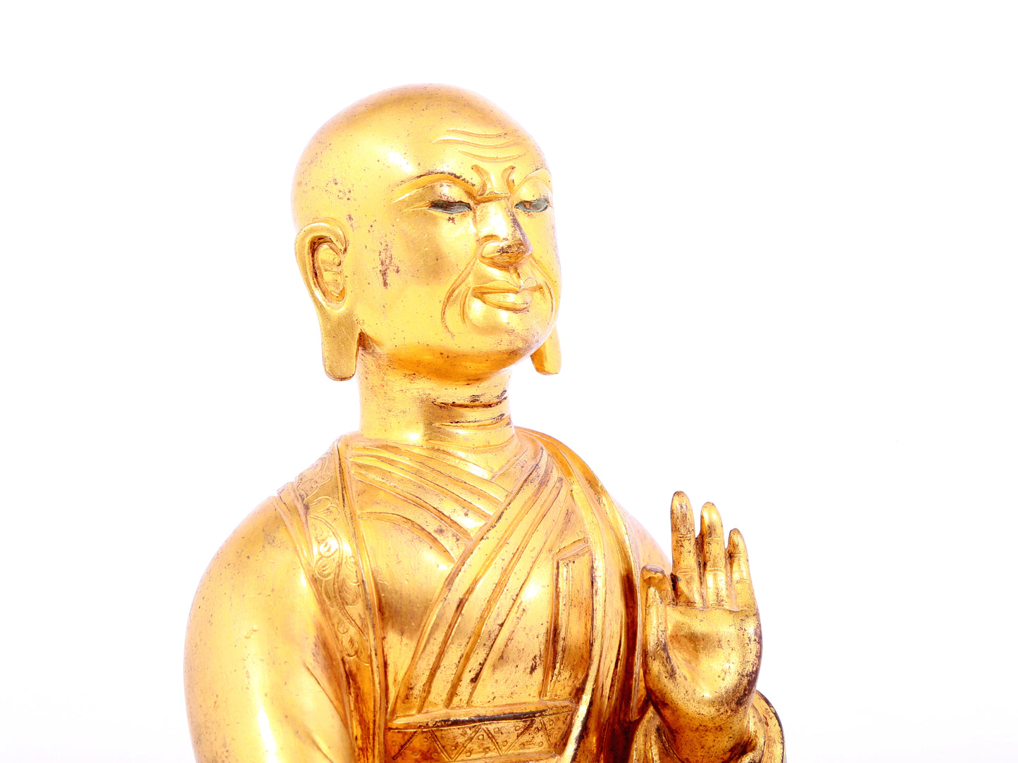 A solemn gilt bronze statue of guru