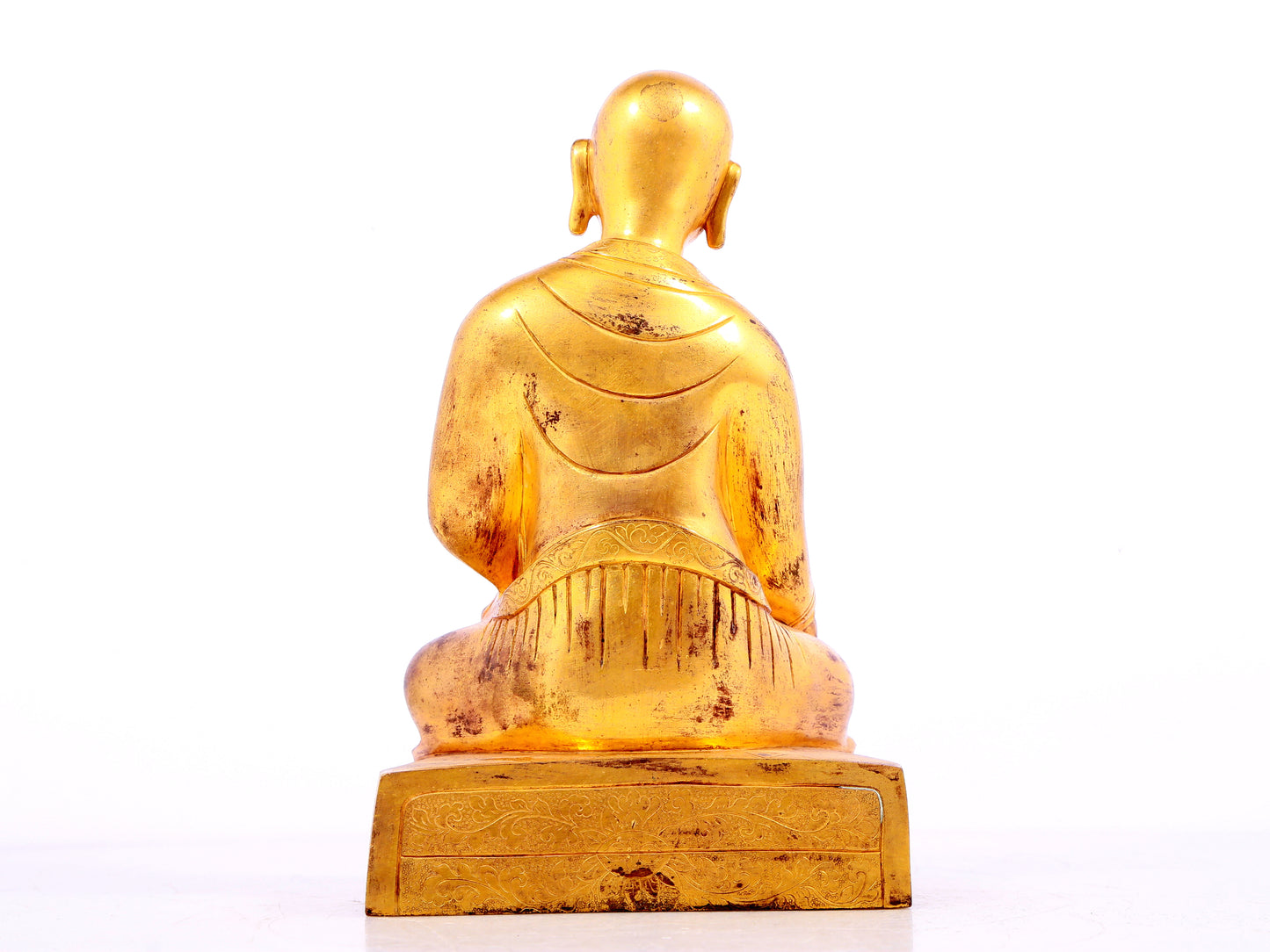 A solemn gilt bronze statue of guru