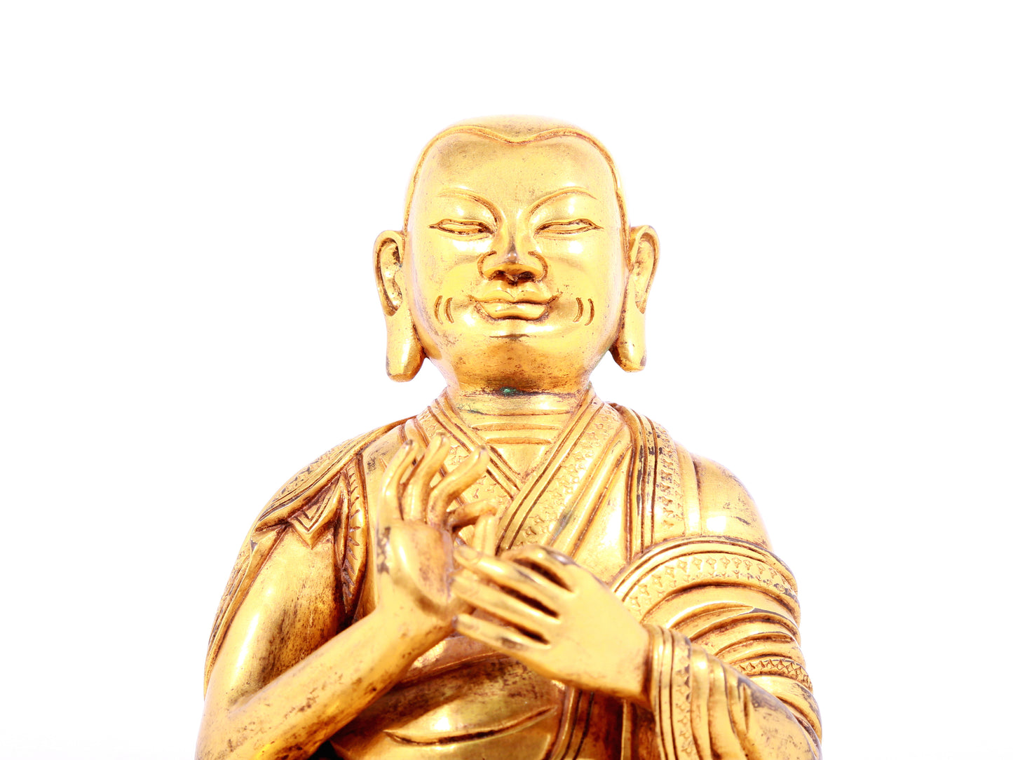 A solemn gilt bronze statue of guru