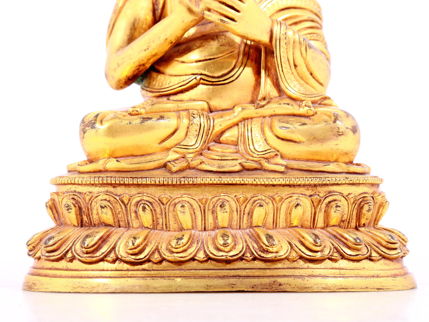 A solemn gilt bronze statue of guru