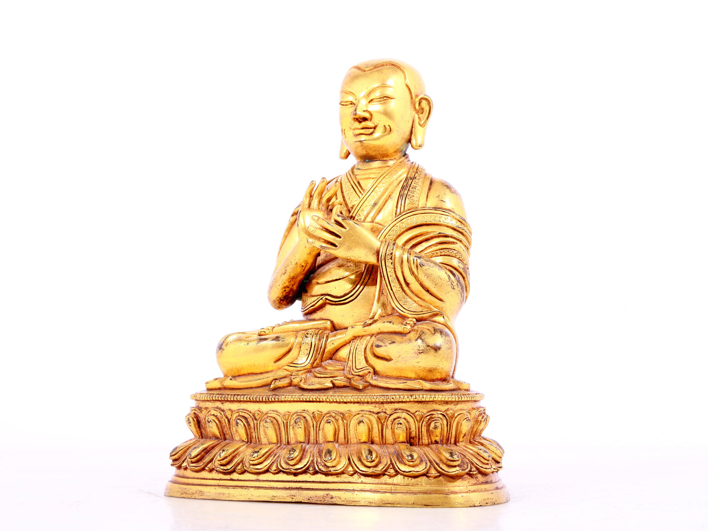 A solemn gilt bronze statue of guru