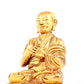 A solemn gilt bronze statue of guru