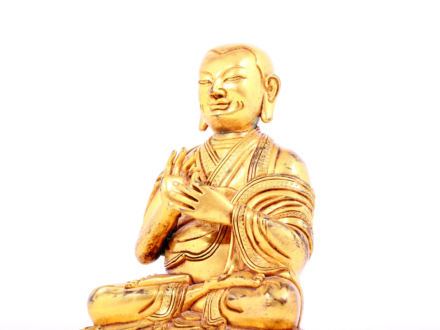 A solemn gilt bronze statue of guru