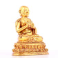 A solemn gilt bronze statue of guru