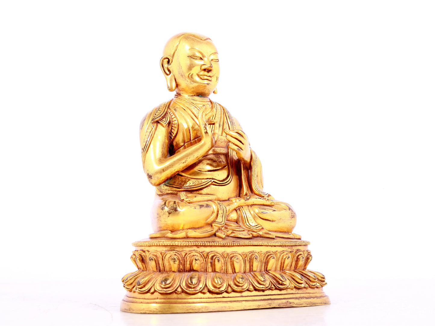 A solemn gilt bronze statue of guru