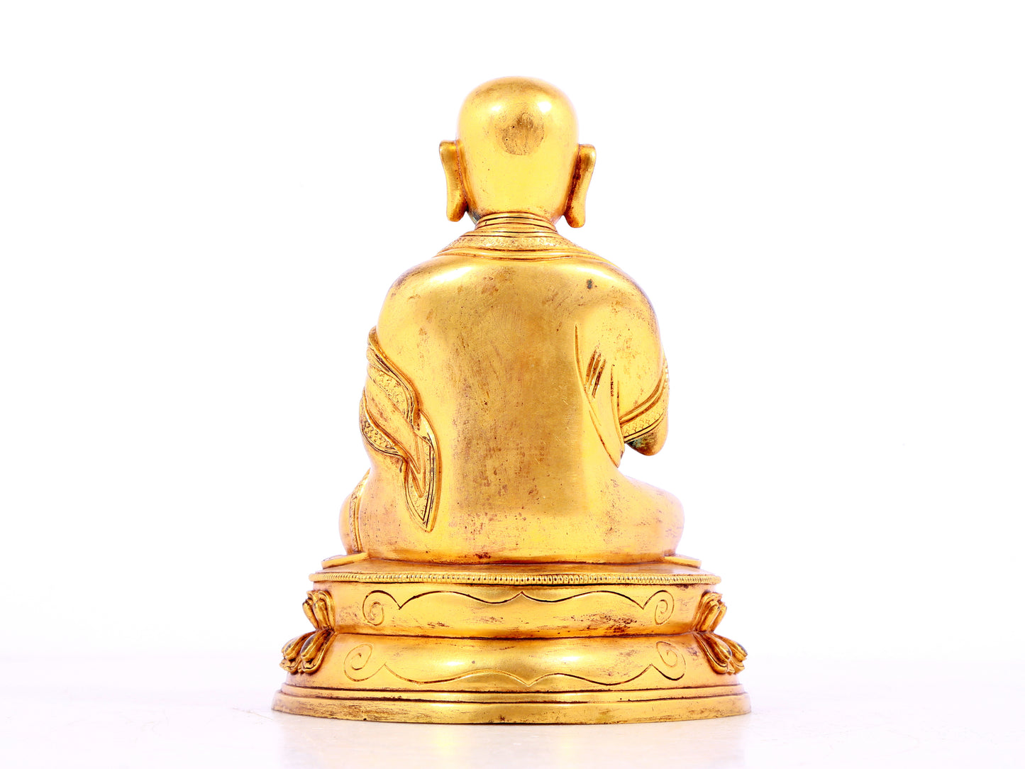 A solemn gilt bronze statue of guru