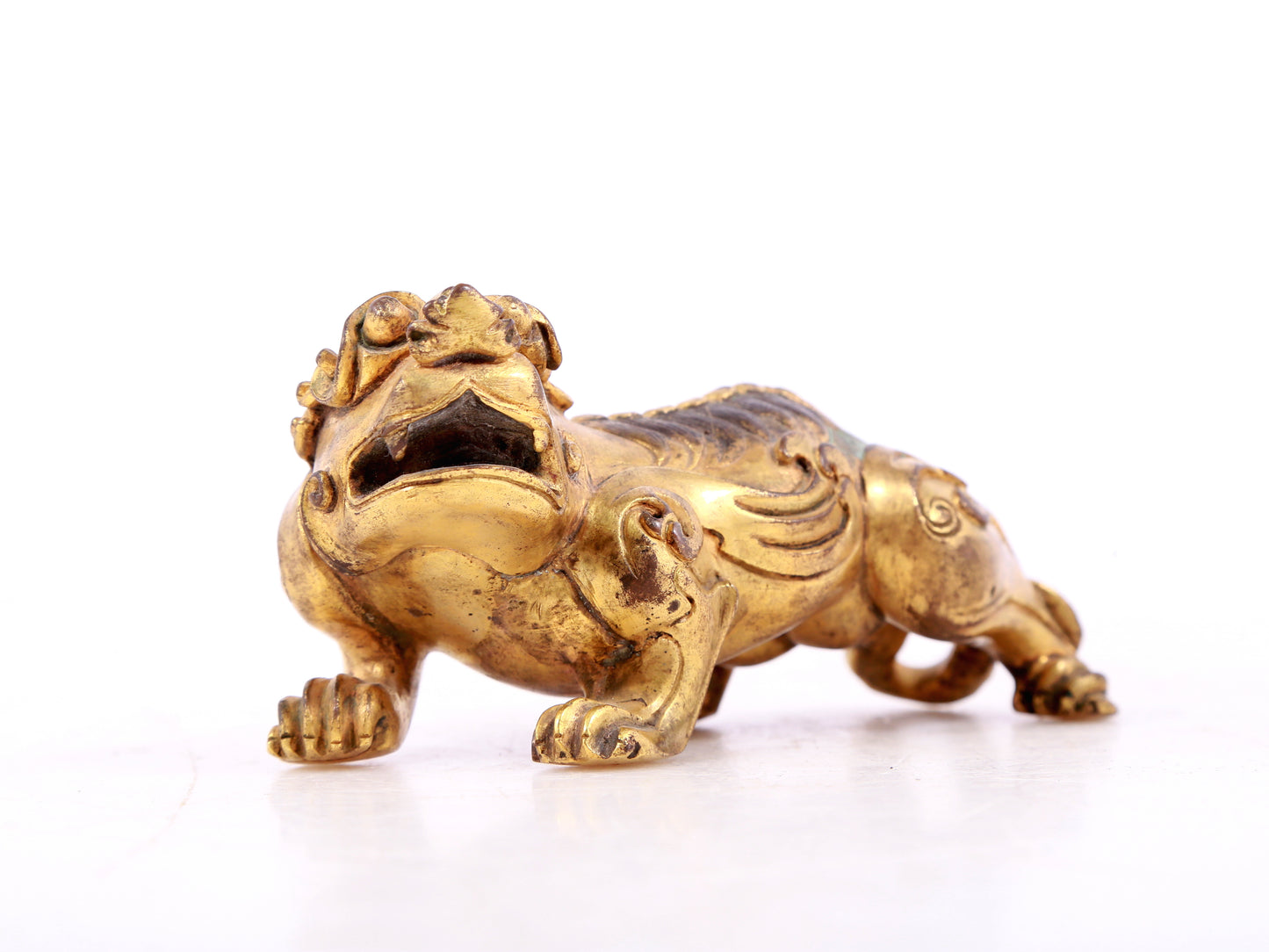 An exquisite gilt copper auspicious animal ornament