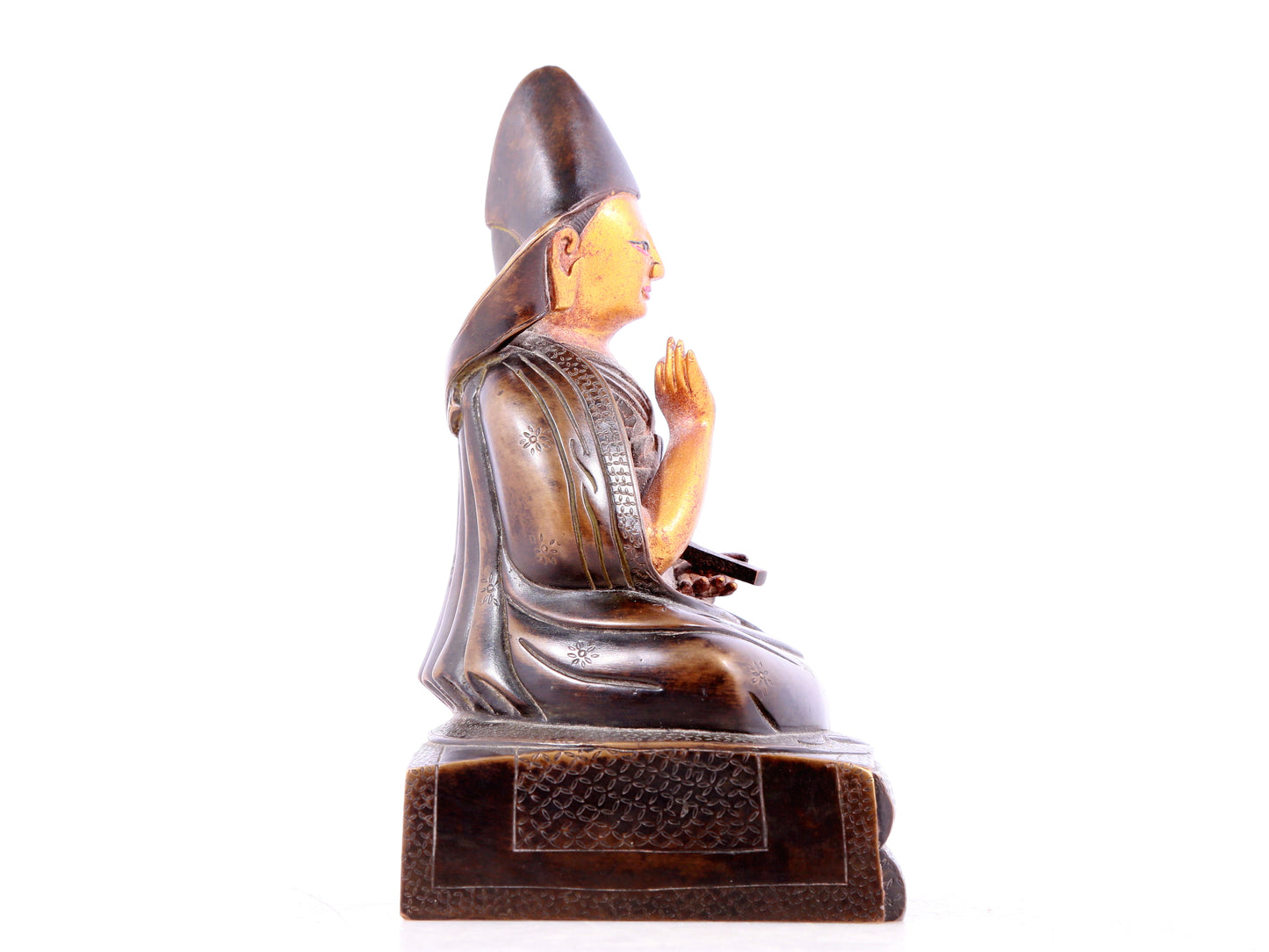 A solemn gilt bronze statue of guru