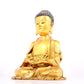 A solemn gilt bronze statue of Sakyamuni