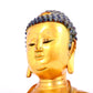 A solemn gilt bronze statue of Sakyamuni