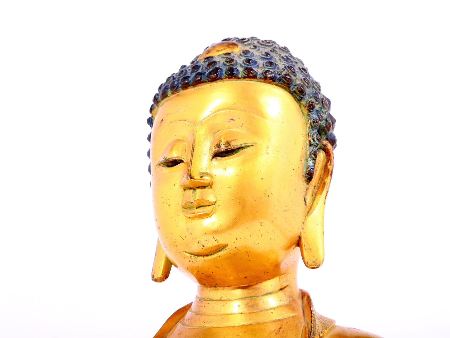 A solemn gilt bronze statue of Sakyamuni