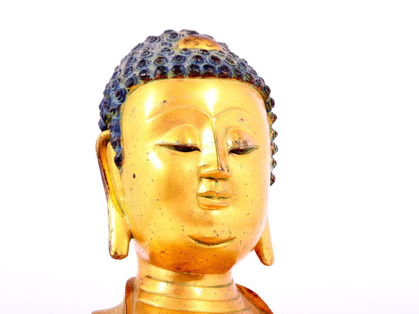 A solemn gilt bronze statue of Sakyamuni