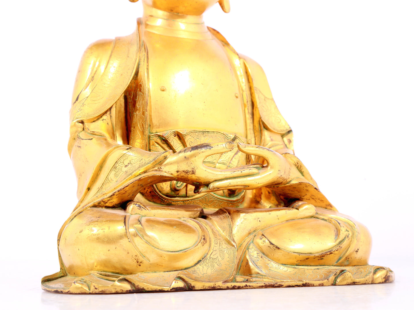 A solemn gilt bronze statue of Sakyamuni