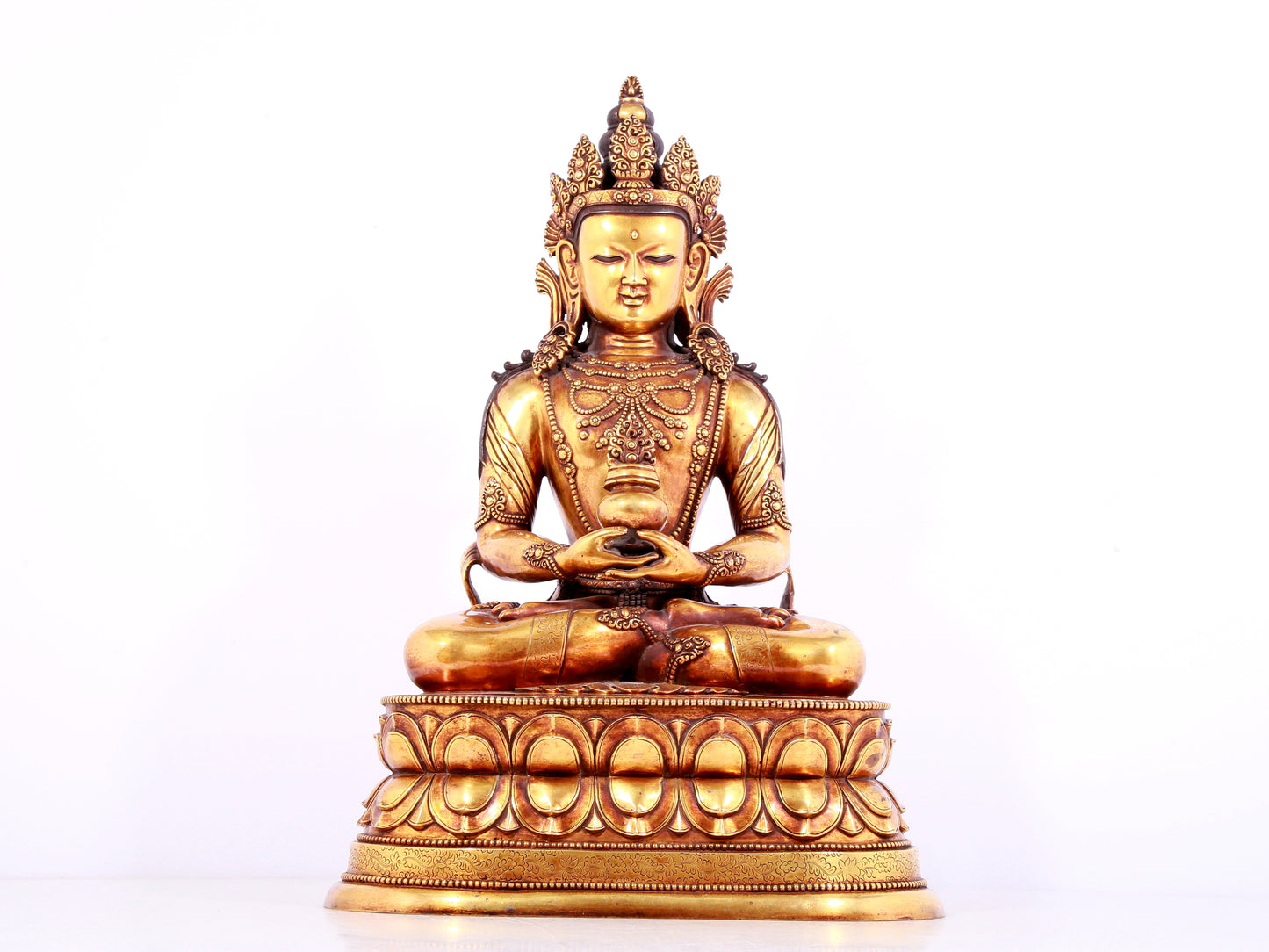 A solemn gilt bronze statue of Amitayus Buddha