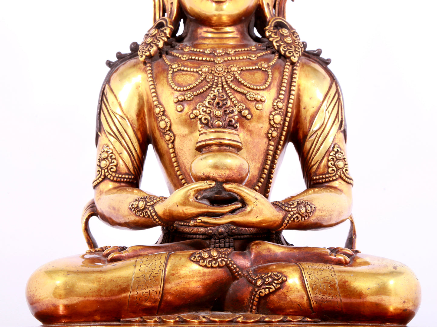 A solemn gilt bronze statue of Amitayus Buddha