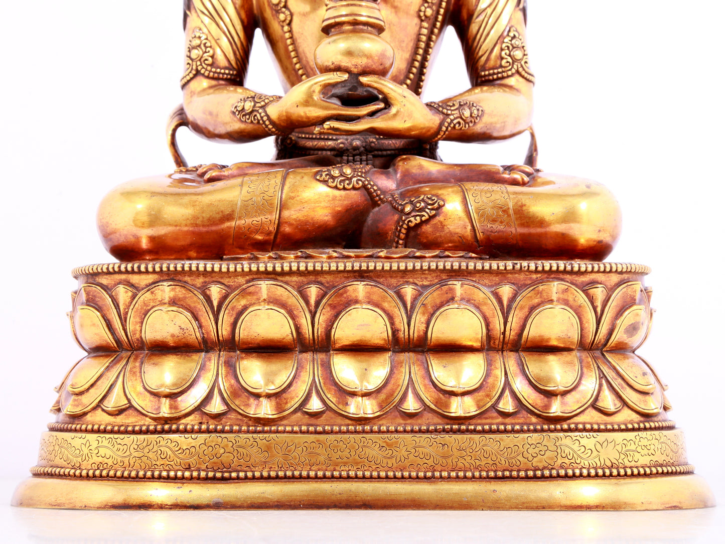 A solemn gilt bronze statue of Amitayus Buddha