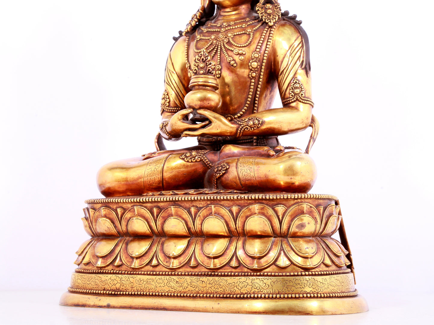 A solemn gilt bronze statue of Amitayus Buddha