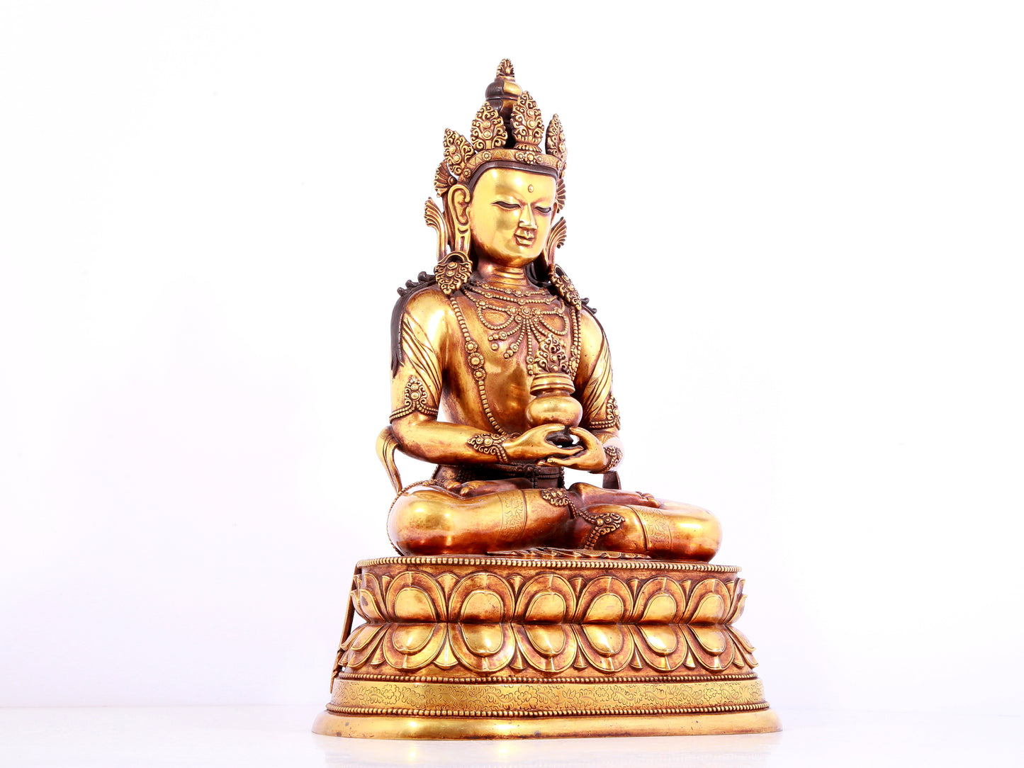 A solemn gilt bronze statue of Amitayus Buddha