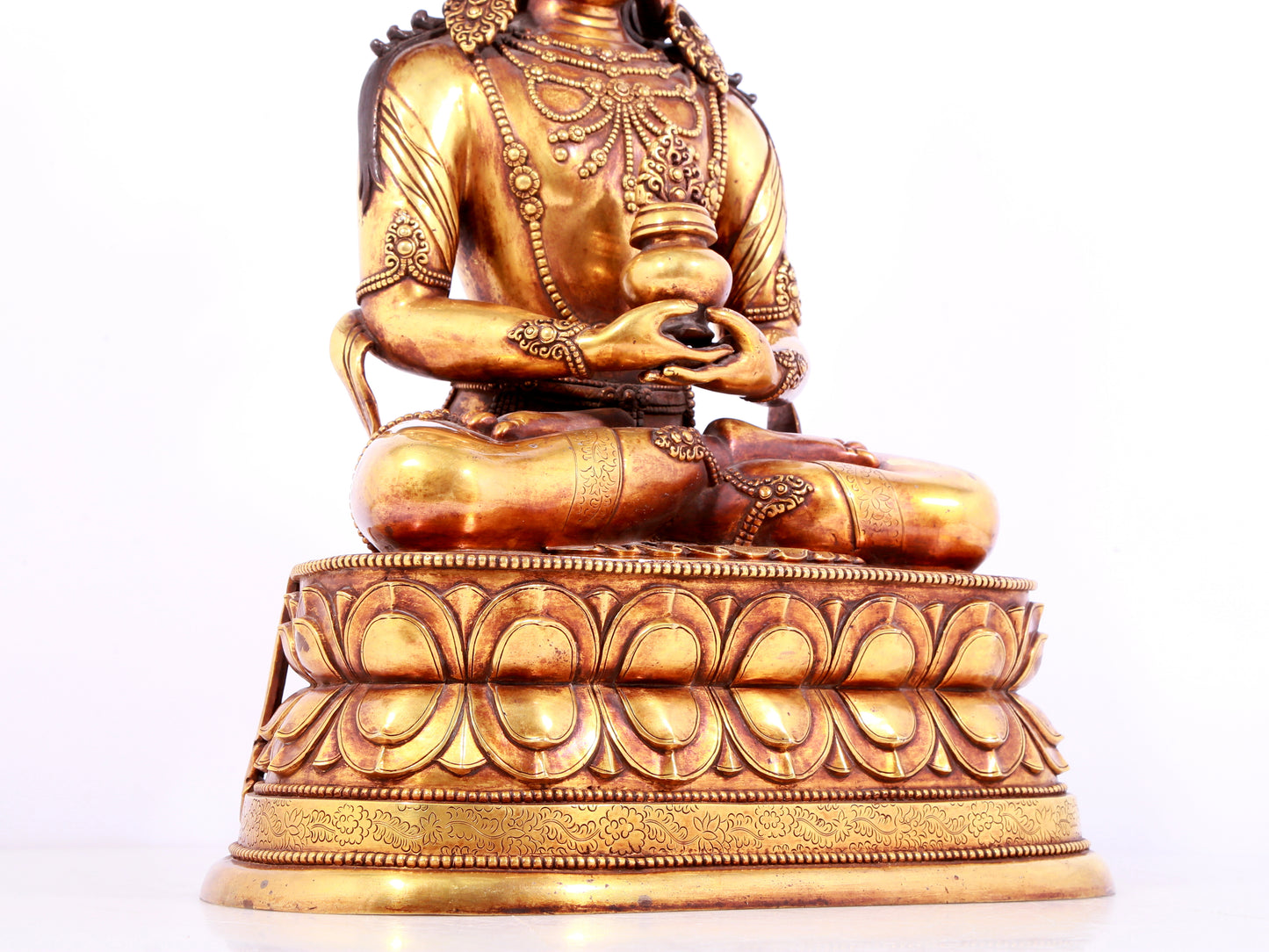 A solemn gilt bronze statue of Amitayus Buddha