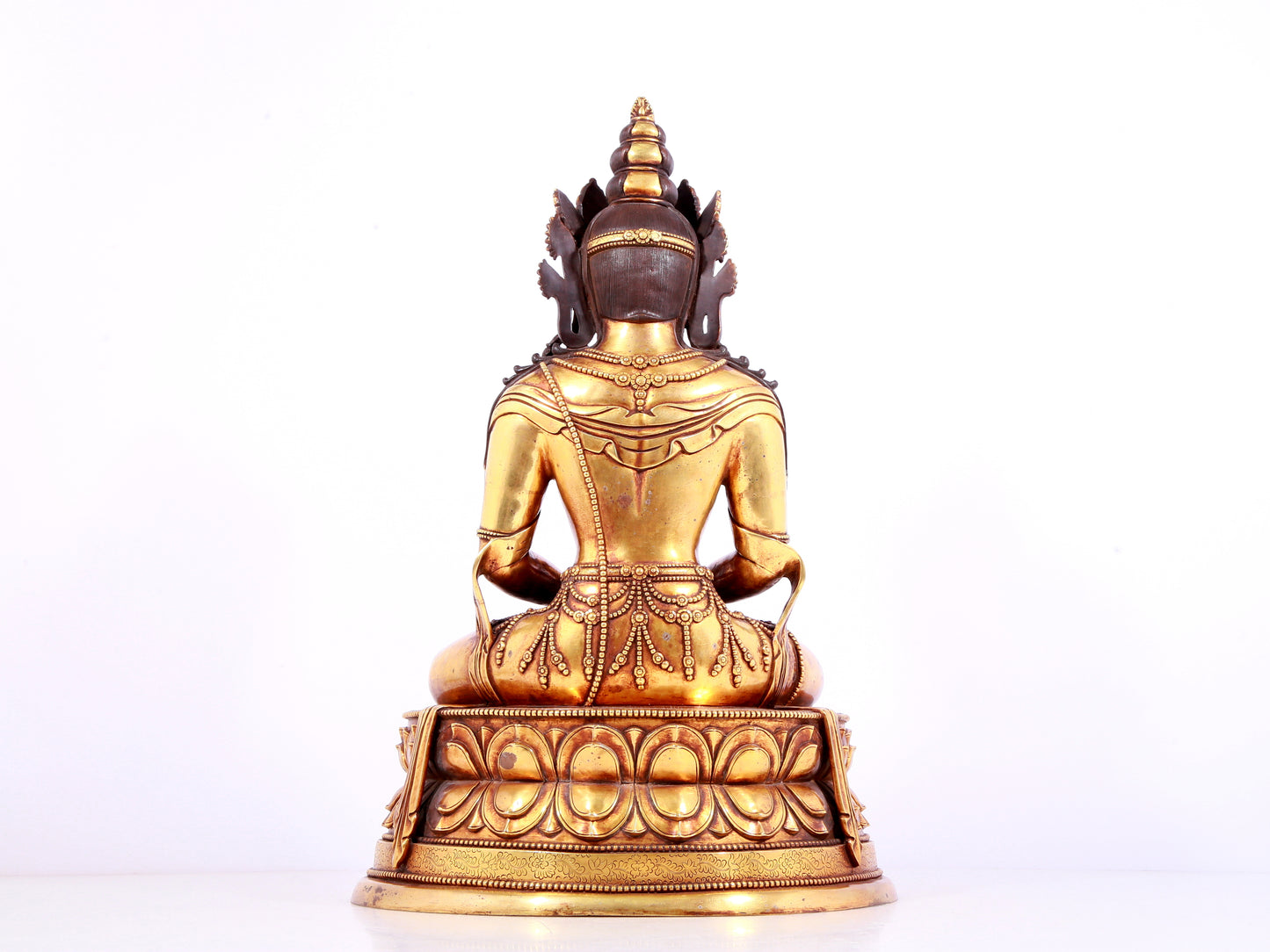 A solemn gilt bronze statue of Amitayus Buddha