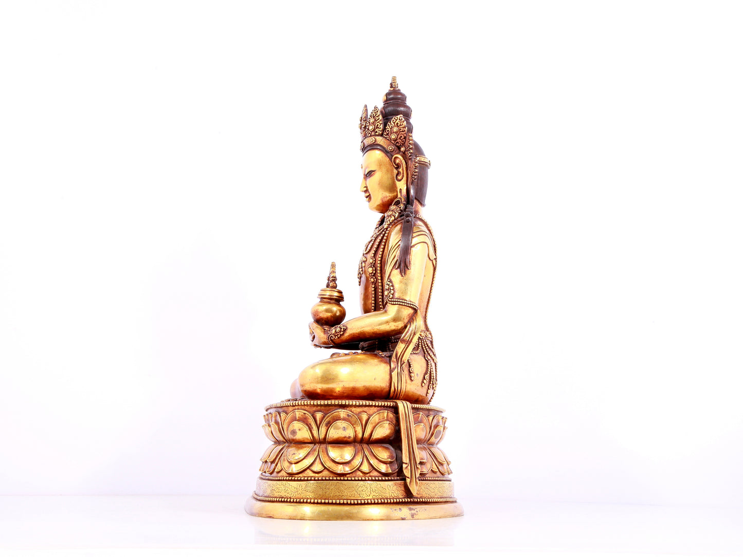 A solemn gilt bronze statue of Amitayus Buddha