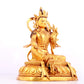 A solemn gilt bronze statue of green Tara