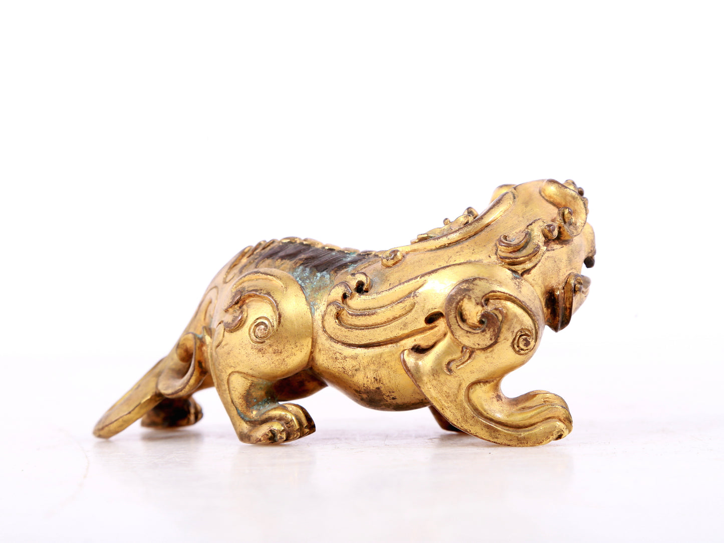 An exquisite gilt copper auspicious animal ornament