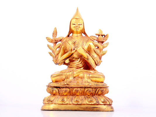 A solemn gilt bronze statue of Tsongkhapa