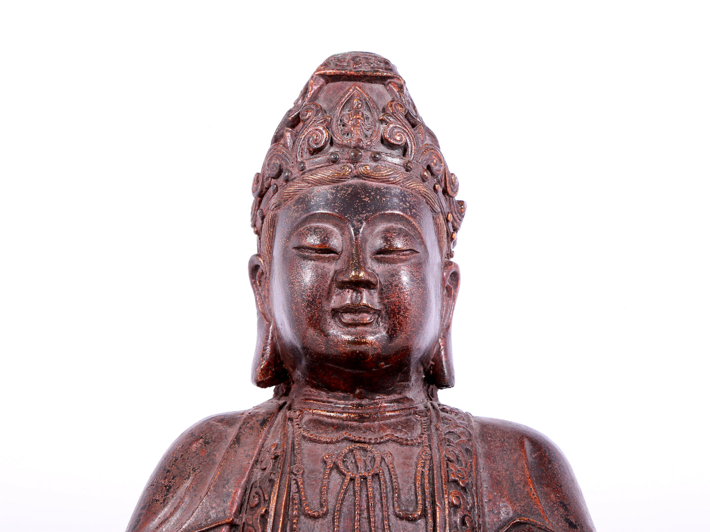 A solemn bronze Guanyin statue